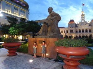 Kids pose with "Uncle Ho" in the heart of Ho Chi Minh City, formerly Saigon.