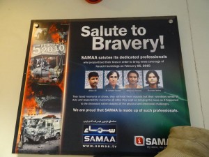 A sign in the Samaa TV newsroom in Karachi honors fallen colleagues. 